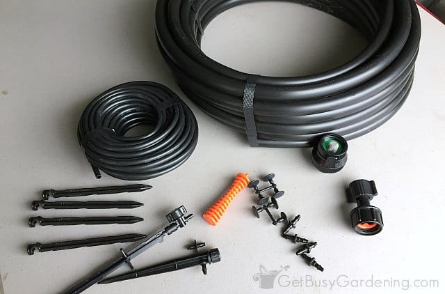 Some contents of a drip irrigation kit for potted plants