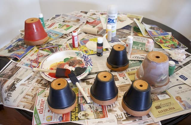 Clay pots drying after the base coat of acrylic paint