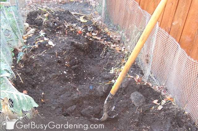 Turning the compost in my larger DIY bin