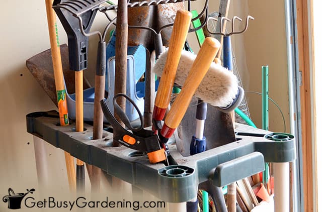 Storage rack for long handled garden tools