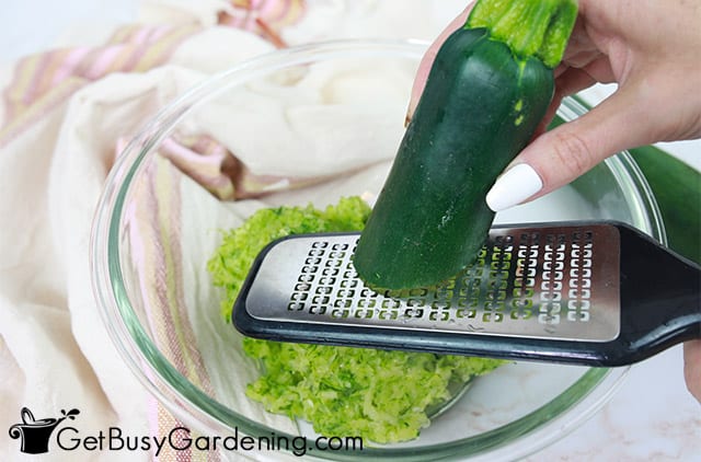 Grating fresh zucchini for making relish