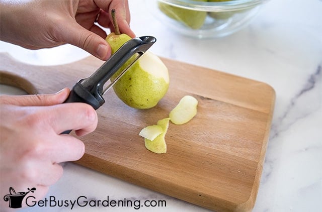 Pealing pears before canning them