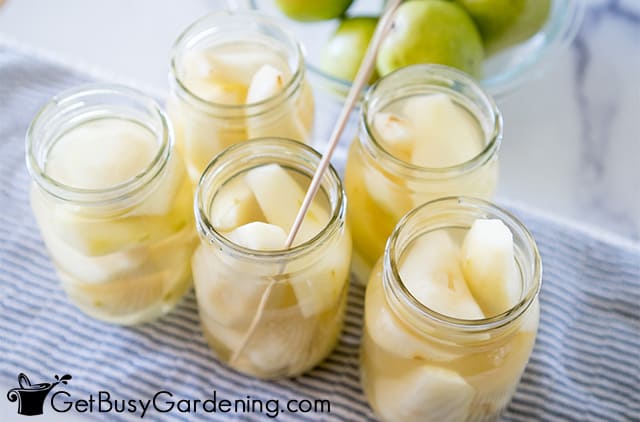 Popping air bubbles in a jar of pears