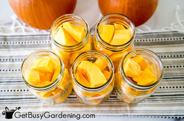 Pumpkin pieces packed into canning jars