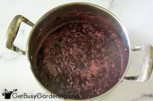 Boiling down the grape jelly to thicken it