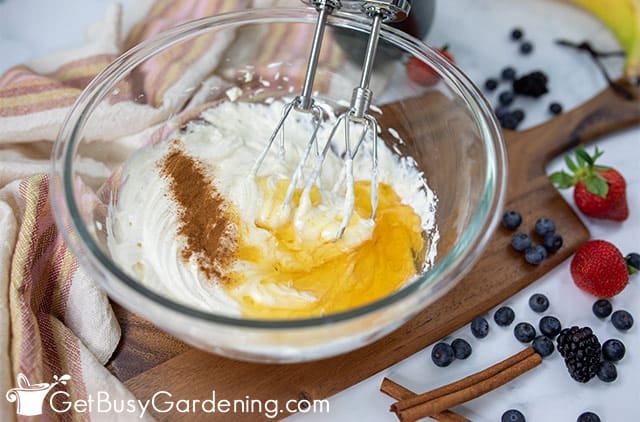 Mixing the cream cheese fruit dip ingredients