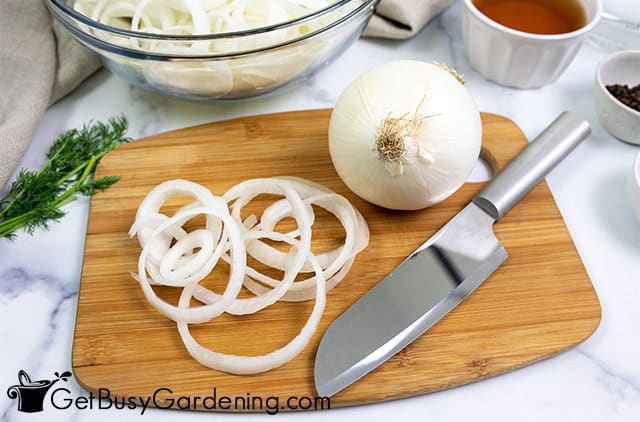 Slicing white onions for pickling