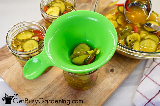 Filling jars with sweet pickles