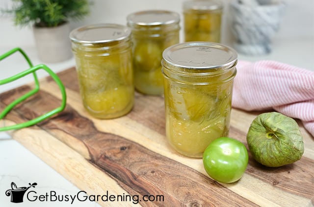 Jars of canned tomatillos ready for storage
