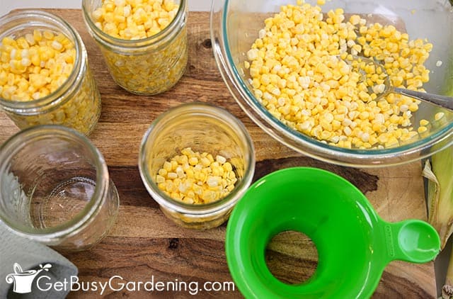 Adding corn to the canning jars