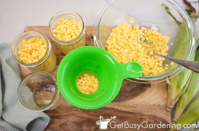 Filling canning jars with corn