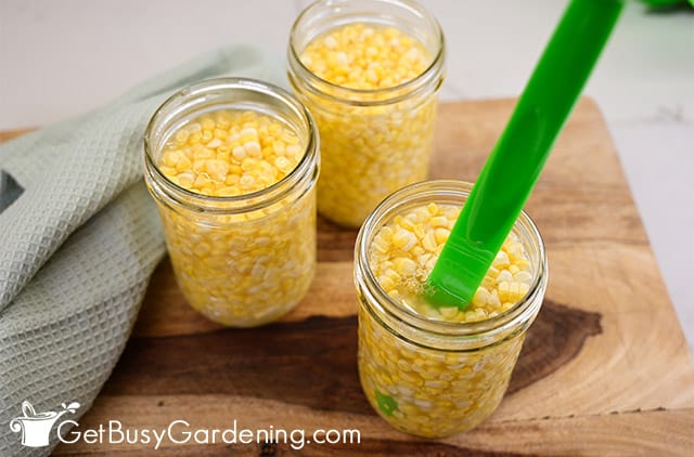 Popping air bubbles in a jar of corn